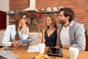 Real estate agent offers the purchase of a home for a young couple