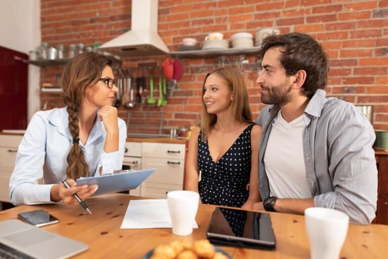 Real estate agent offers the purchase of a home for a young couple