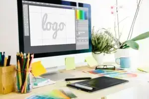 Desk with color guides, desktop computer with logo graphic